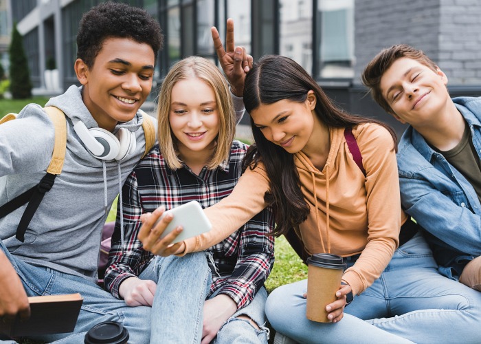Teenagers taking selfie - Activities for Teens near Kalamazoo