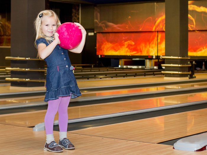 Kids-Bowl-Free-Girl-bowling-with-bowling-shoes-Lansing Kids-Bowl-Free-Girl-bowling-with-bowling-shoes-Lansing