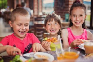 Kids eating at a brewery