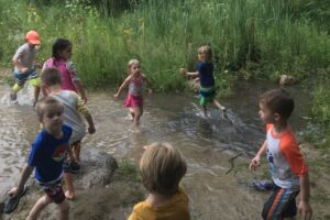 Kalamazoo Nature Center kids playing in creek