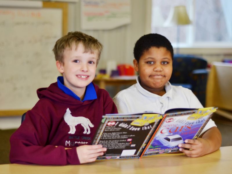 Battle Creek Montessori Academy boys buddy reading