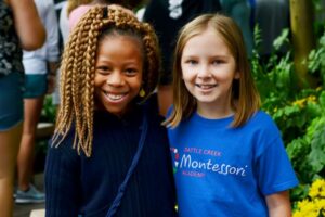 Battle Creek Montessori Academy girls smile at camera